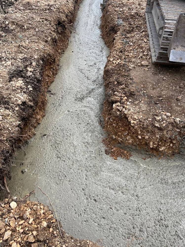 Concrete running the length of a foundation trench